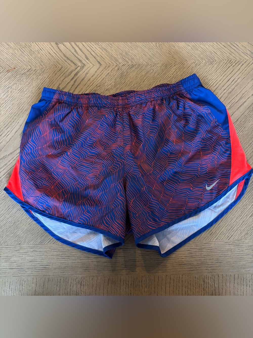 Nike Blue Athletic Shorts with Red Graphic Stripes